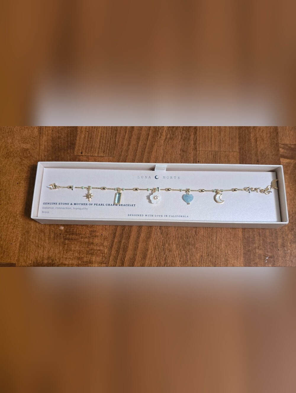 Luna Norte Gold Charm Bracelet with White Flower & Light Blue Heart